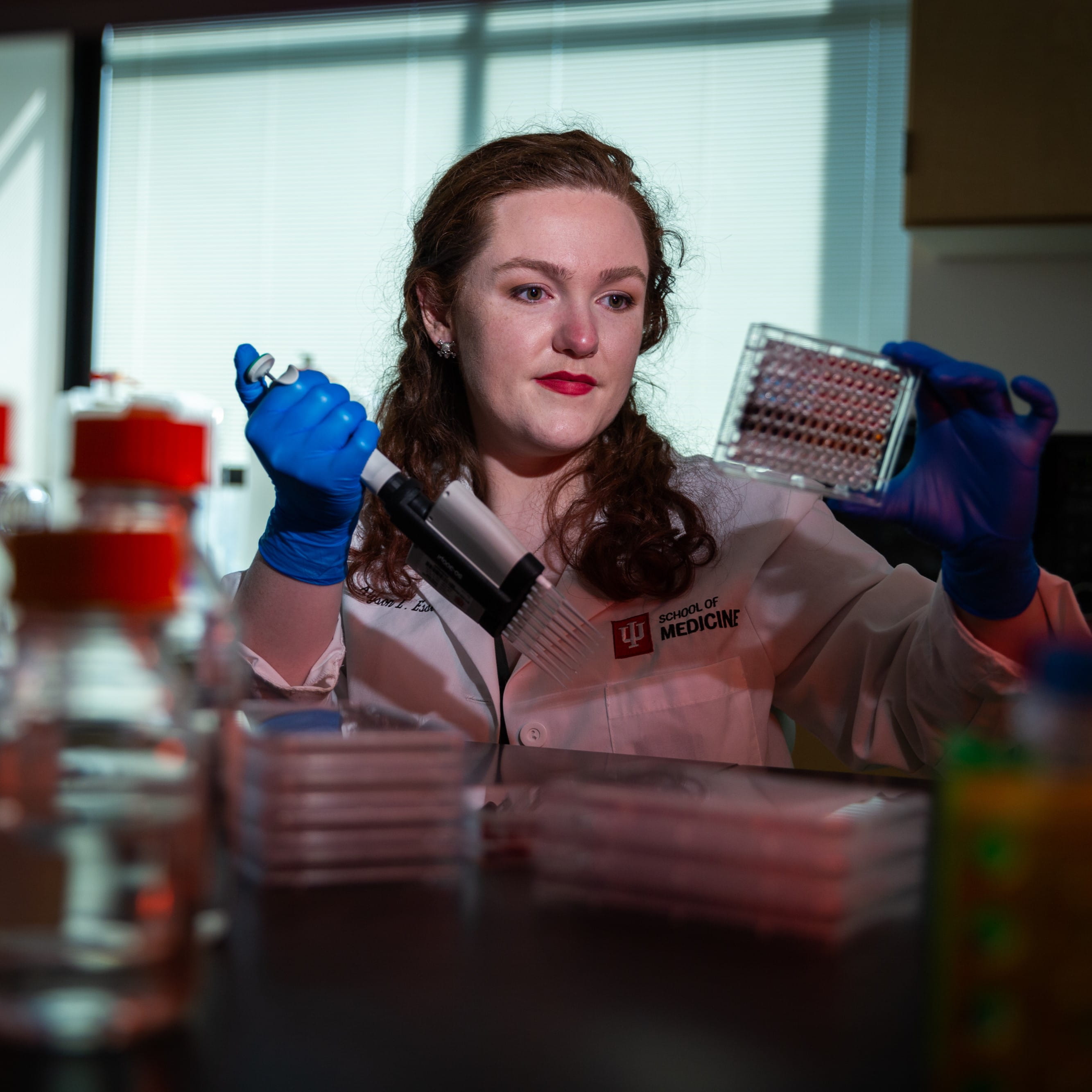 allyson essex prepares samples in the lab