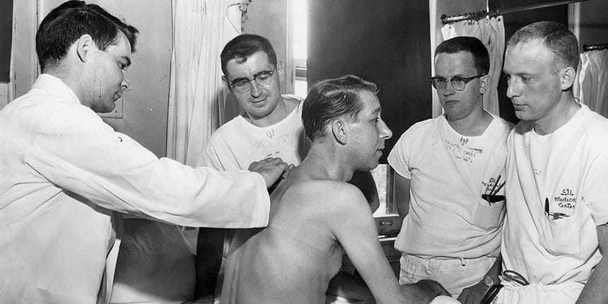 Historic photo of med students performing exam