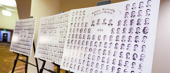 composite photos of multiple classes displayed on easels 