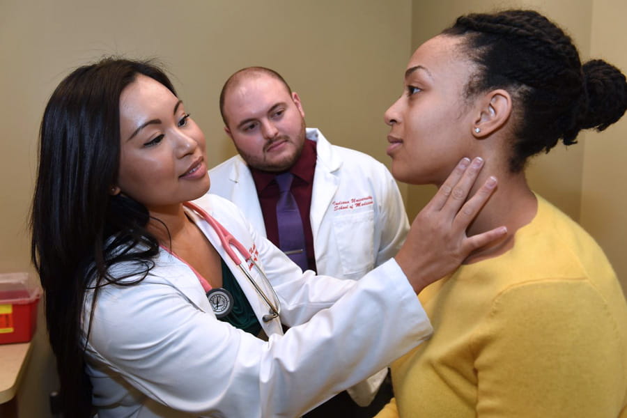 a student performs a clinical exam
