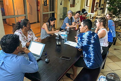 Medical student Micaela Gaviola seated with others in Nicaragua