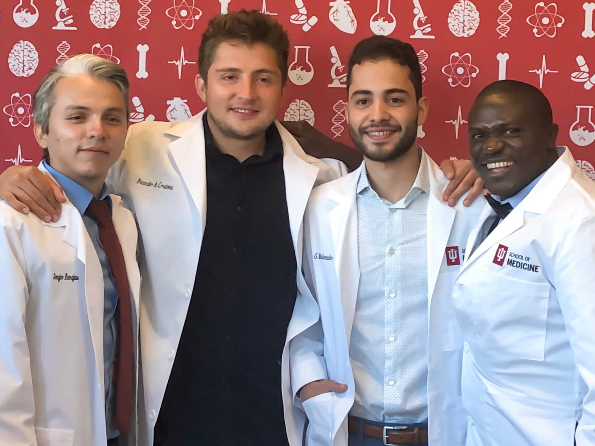 four diverse students pose for a photo at the sacnas conference