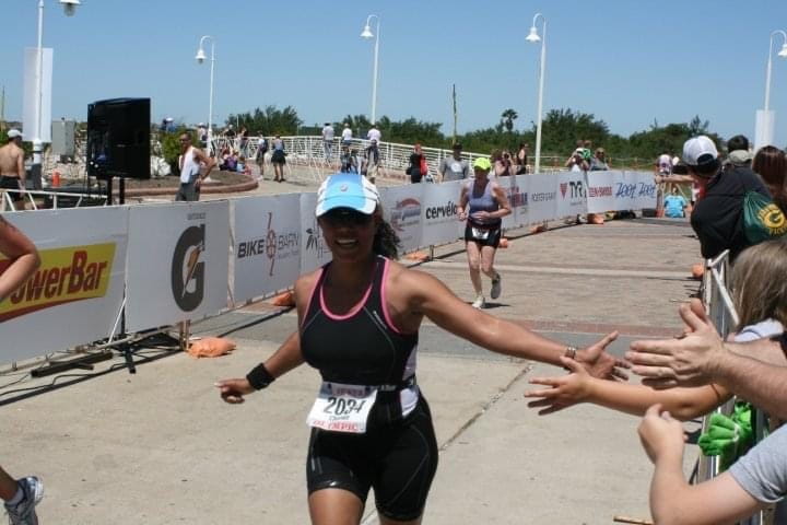 Chemen Neal runs in an Ironman triathlon
