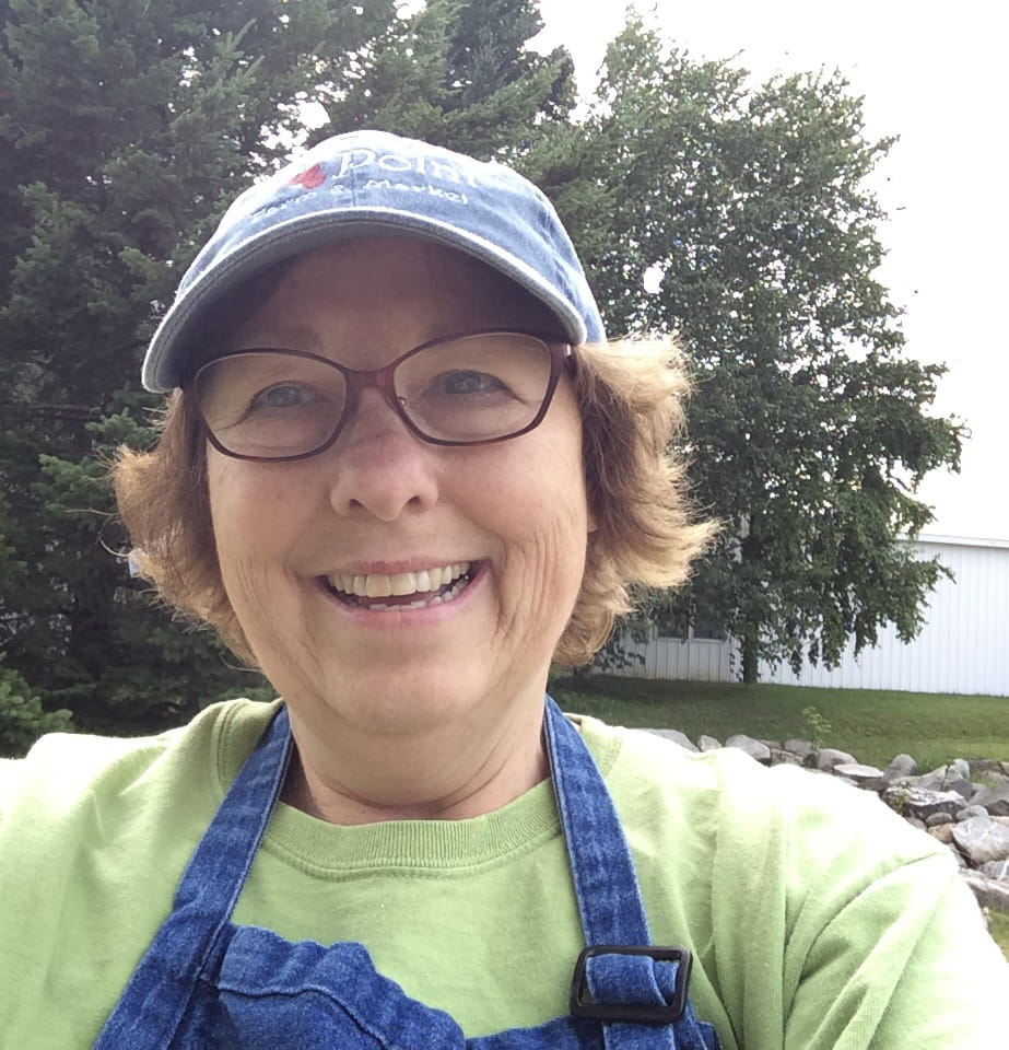 Marilyn Bull in apron at Cherry Point Farm Market