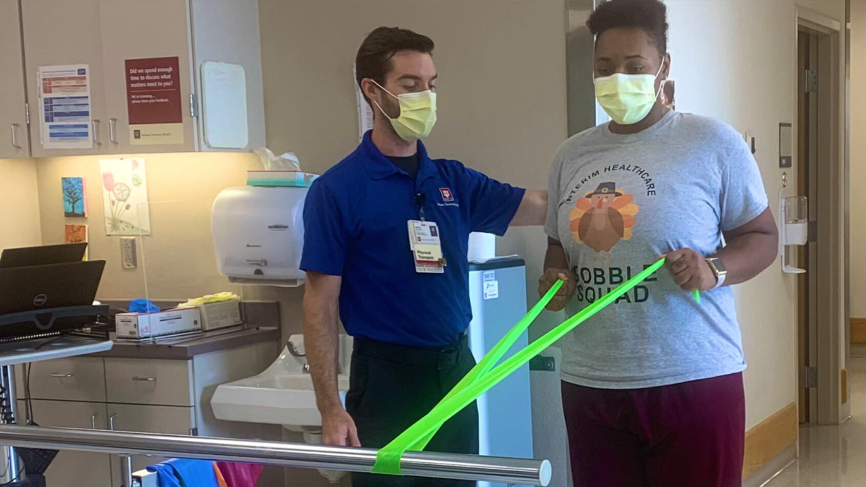 Janai Mitchell works with physical therapist Bryce Showers