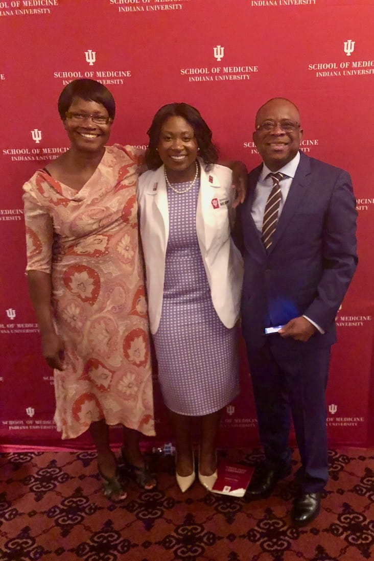 Uche Emili with her parents
