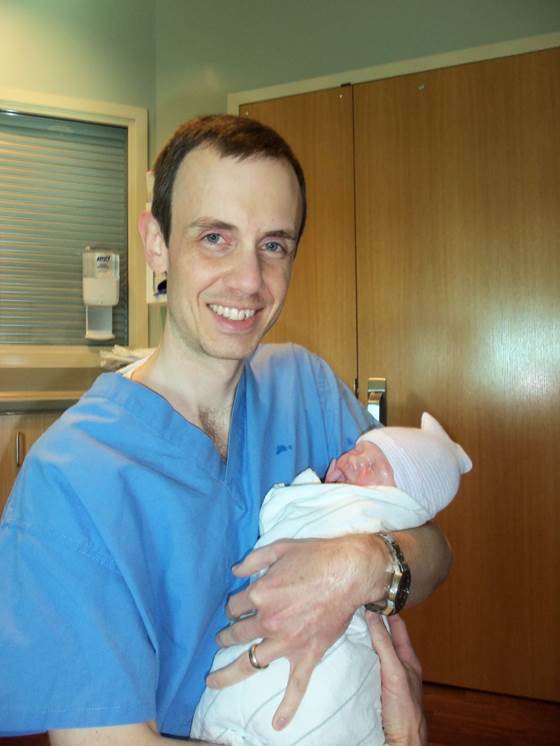 Westbroek holding his newborn son