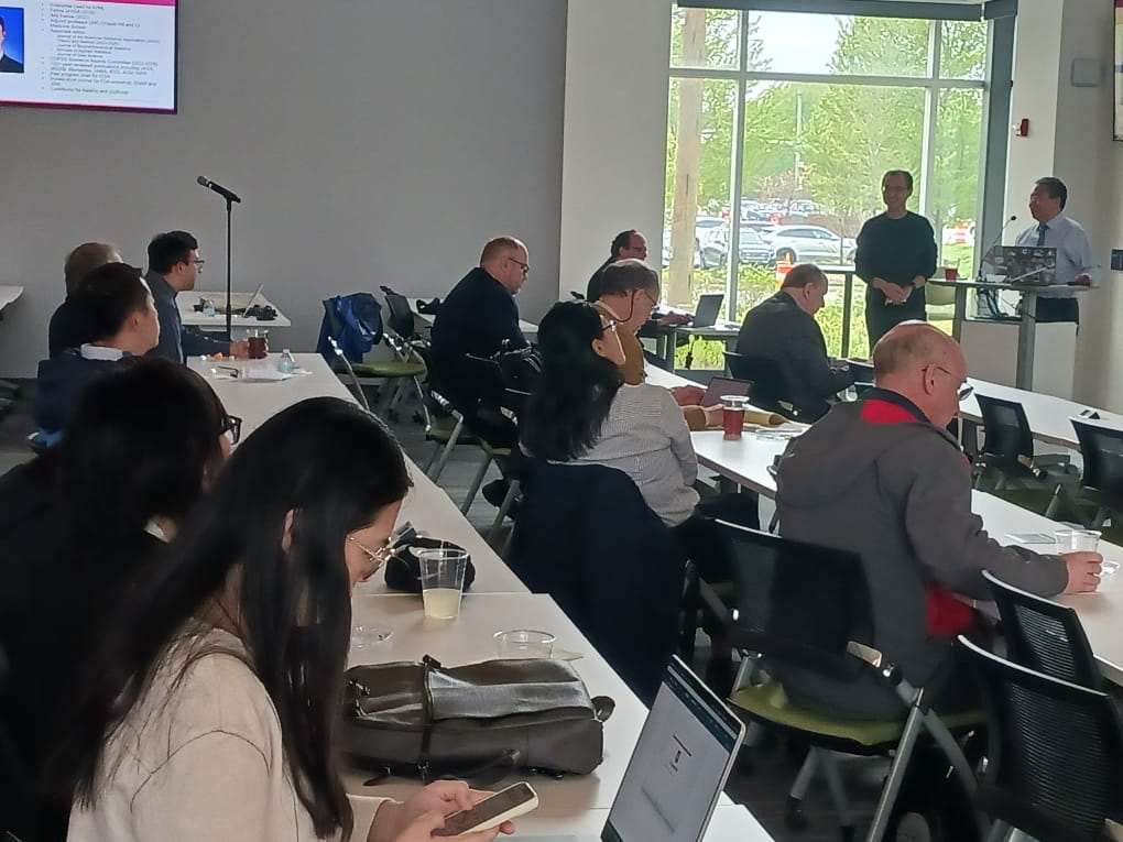 Tables full of participants at the AI conference