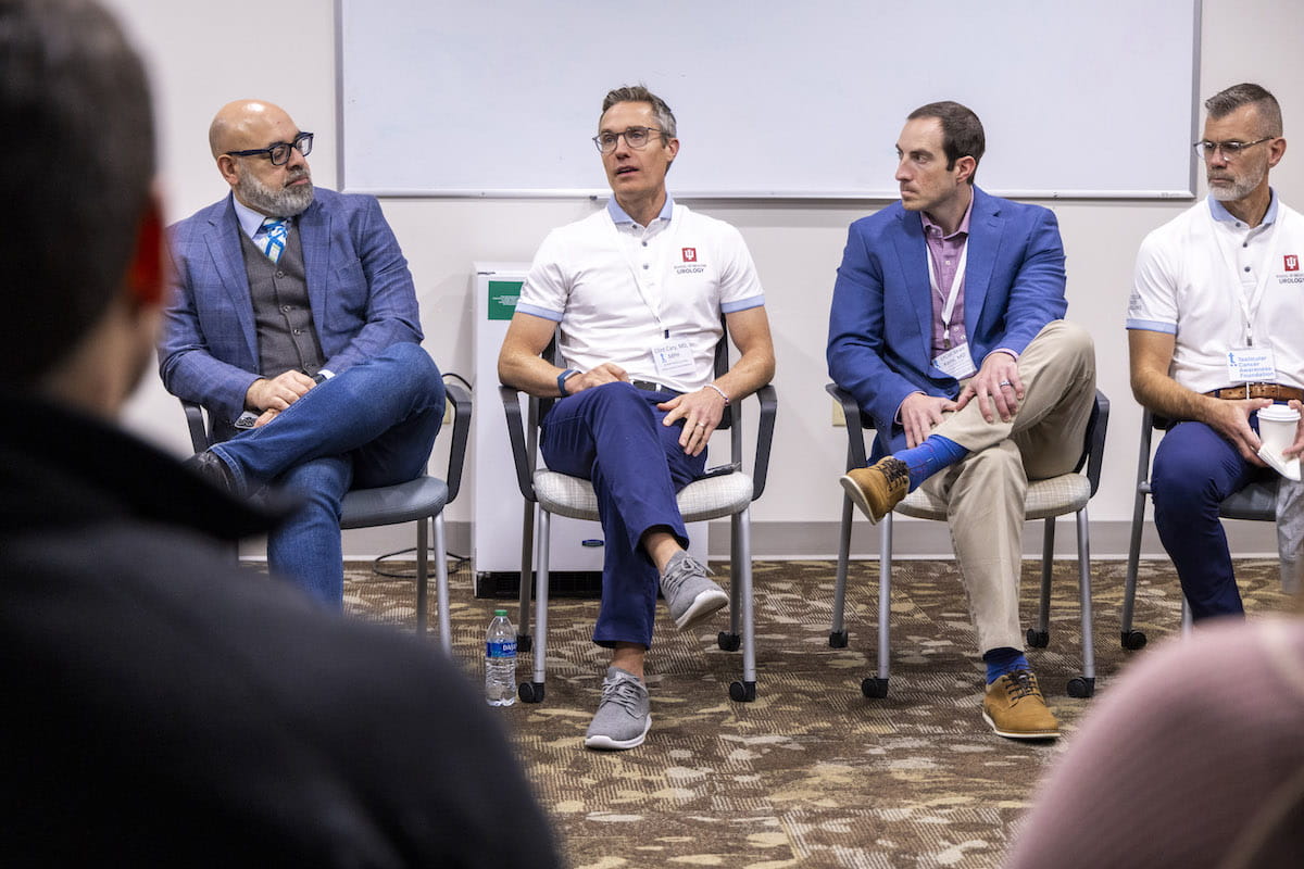 Dr. Clint Cary speaks during a Q&A with medical experts, alongside Geo Espinosa, Sean Kern and Timothy Masterson. 