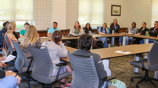 Doctors sitting around a table.