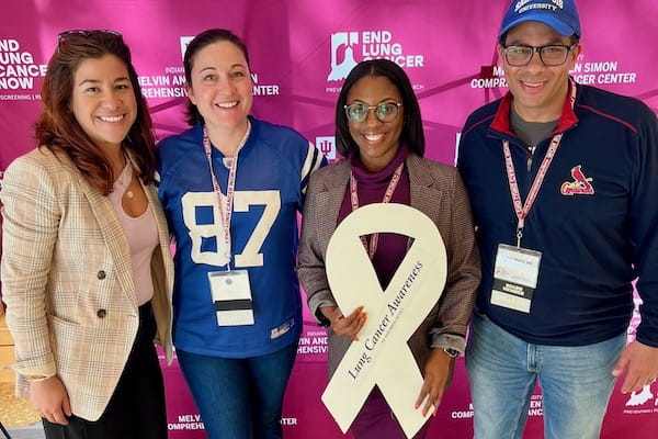 Duncan holding white ribbon with with Sylk Sotto, Catherine Sears and Nasser Hanna
