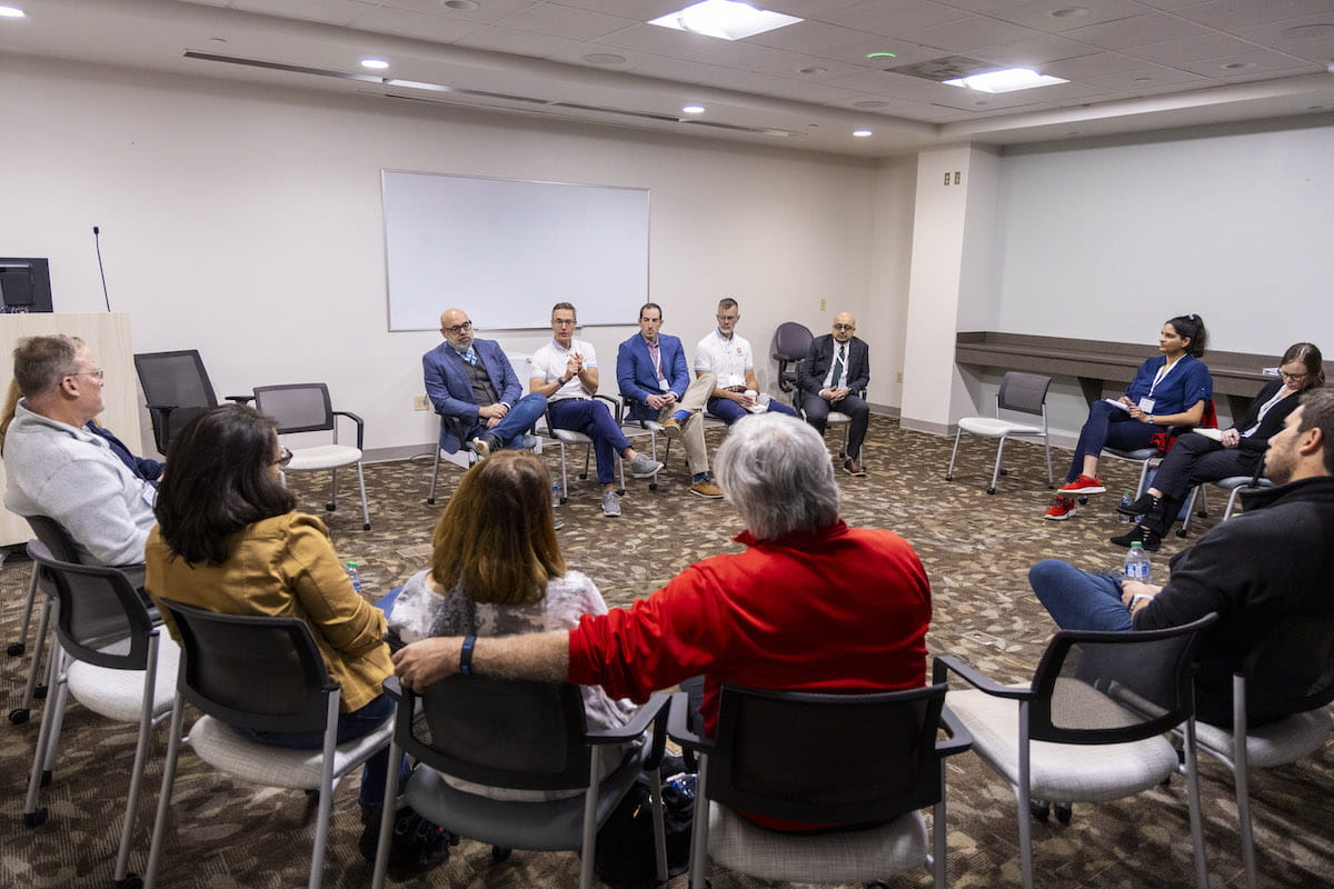 Q&A session with medical experts, groups sitting in a circle