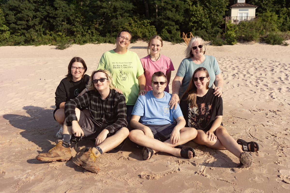 Devin with his family on the beach