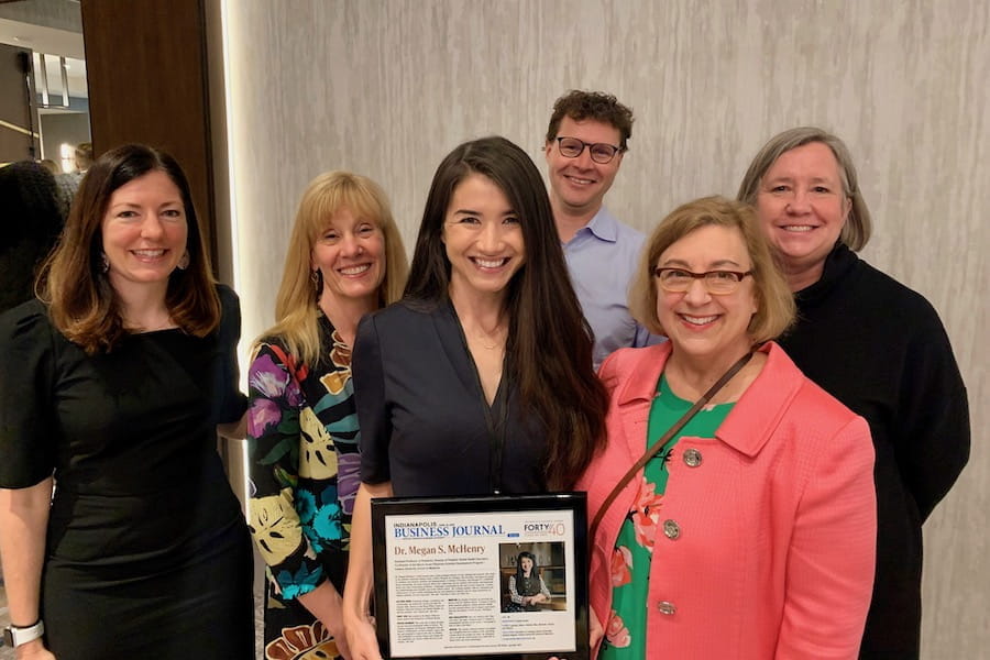 Megan McHenry with global health colleagues at the IBJ Forty Under 40 event