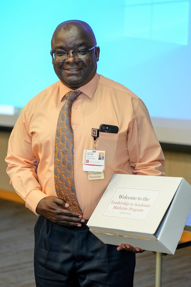 Christopher Njeh with LAMP welcome box