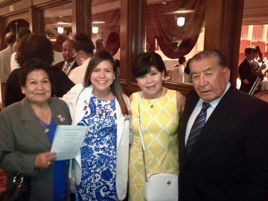 Luna at the white coat ceremony with her mother and grandparents