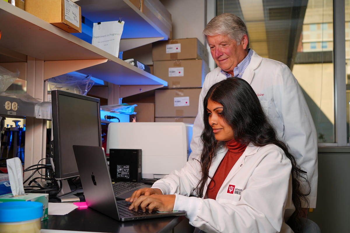 Kelley with a lab tech