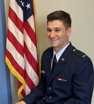 Hunter McCollum in uniform by American flag
