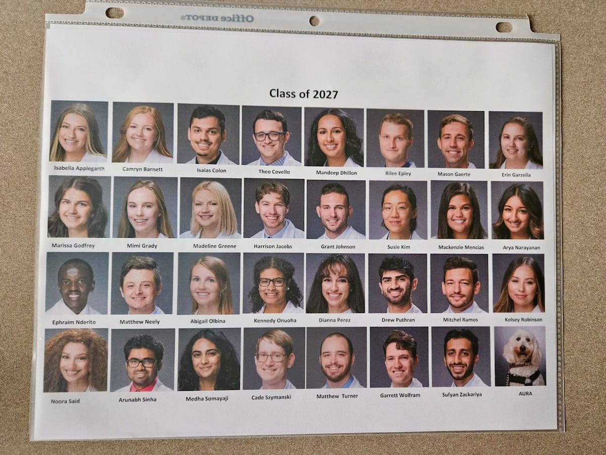 Class of 2027 composite photo with headshots of all South Bend students including goldendoodle Aura at bottom right