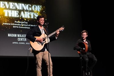 Ari Williams and Jacob Turner perform a western tale on guitar and banjo