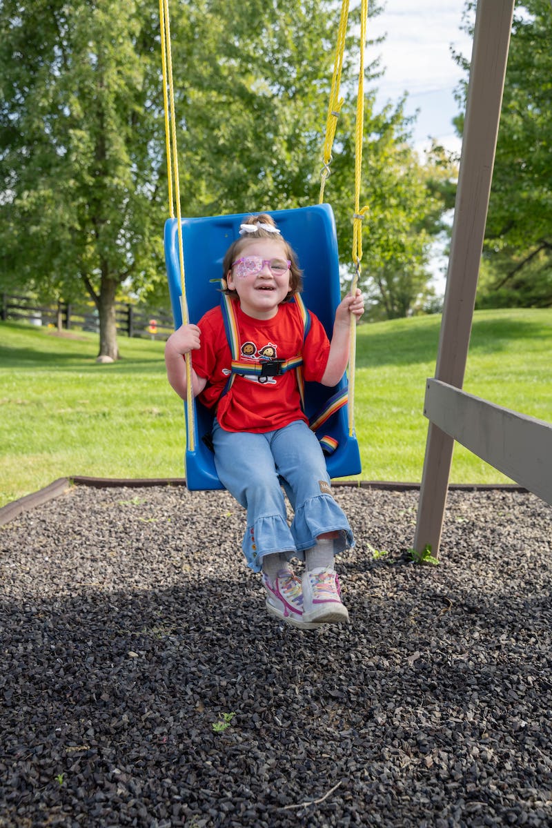 Londyn Hoffman swings at the park