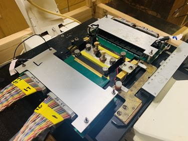 Mini-brain is set up with microscope and recording equipment, ready to record brain injury.