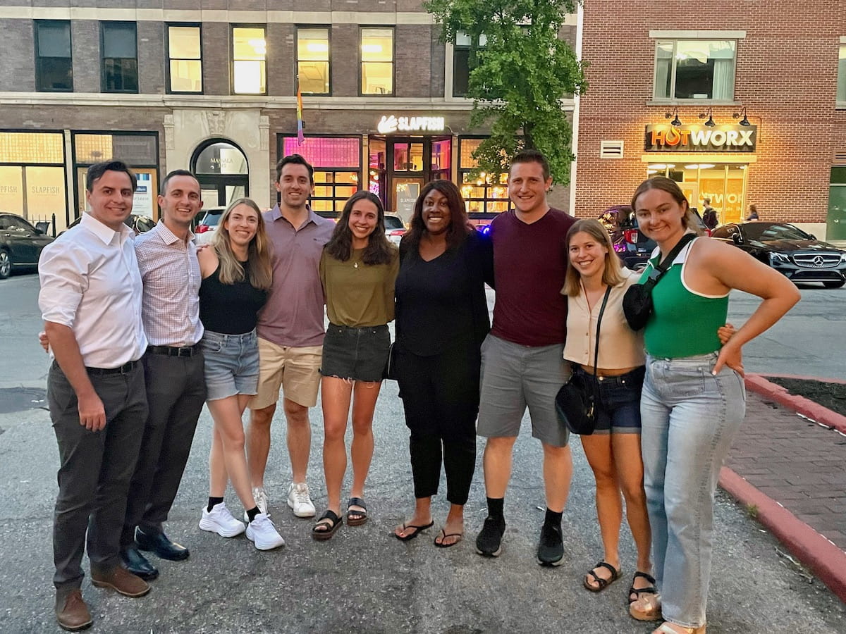 A group of second and first-year urology residents pose together outside a downtown Indianapolis restaurant.
