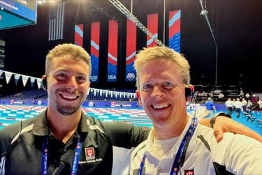 Dr. Zach Wagner and Dr. Stephen Hartsock poolside at Lucas Oil Stadium during a practice for the Olympic Trials in swimming.