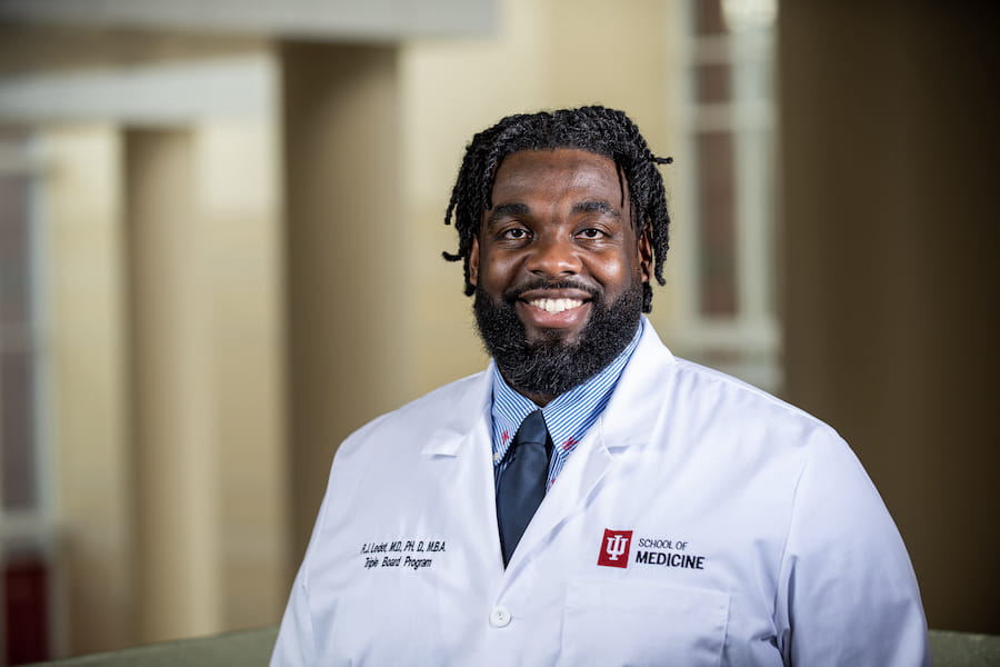 Russell Ledet in white coat