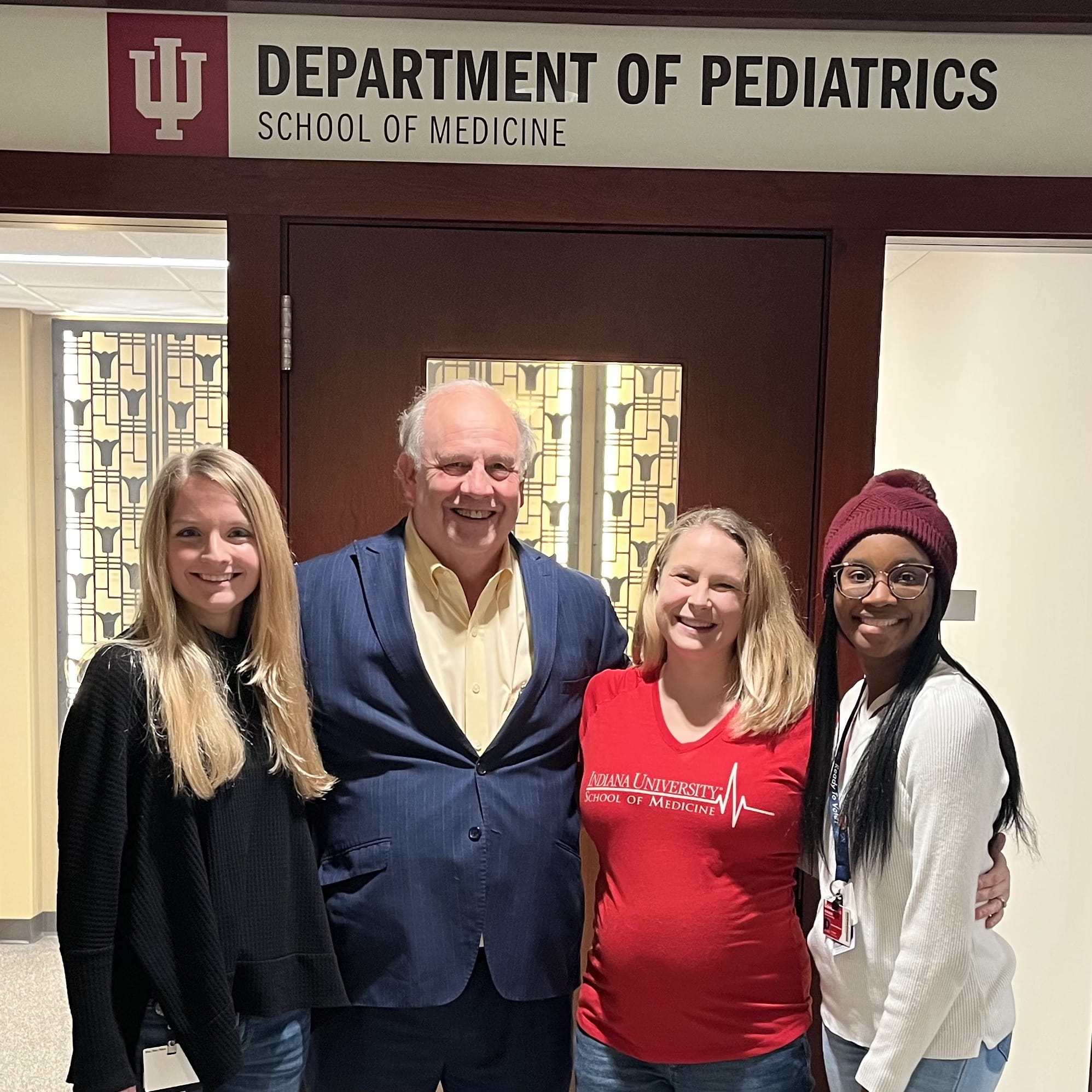 wade clapp and three MD/PhD students stand together for a photo