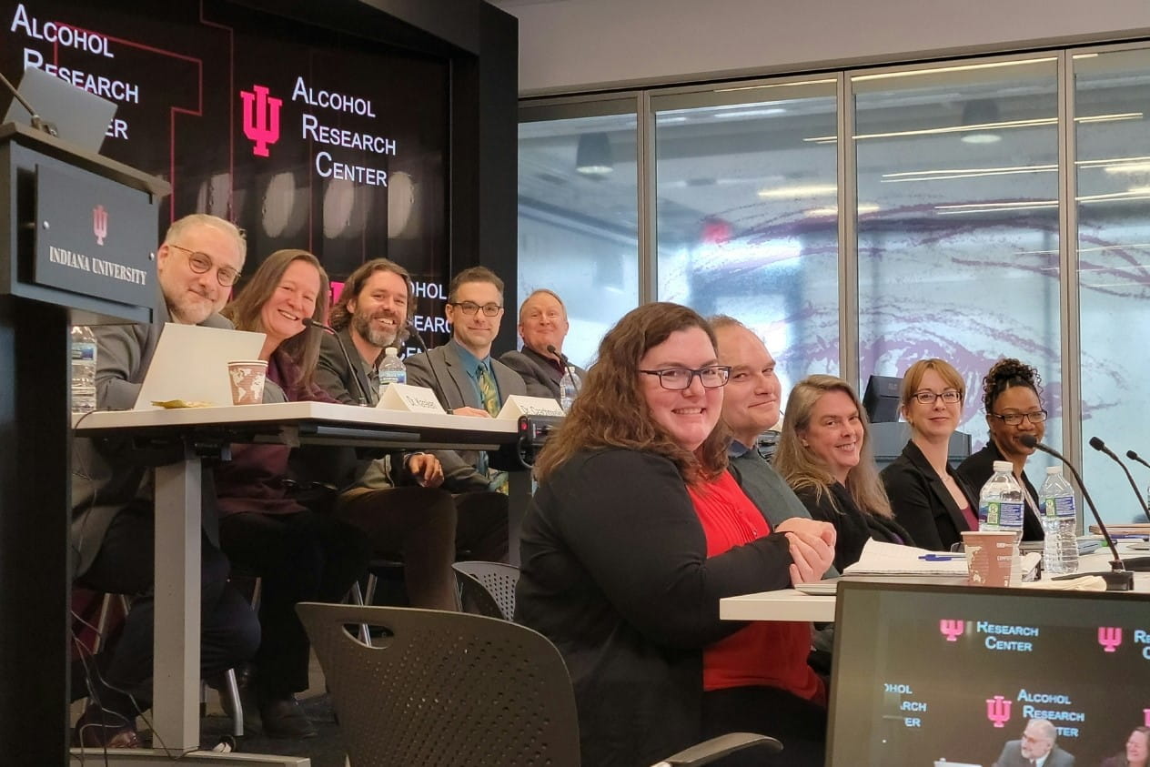 alcohol investigators sit together at a meeting