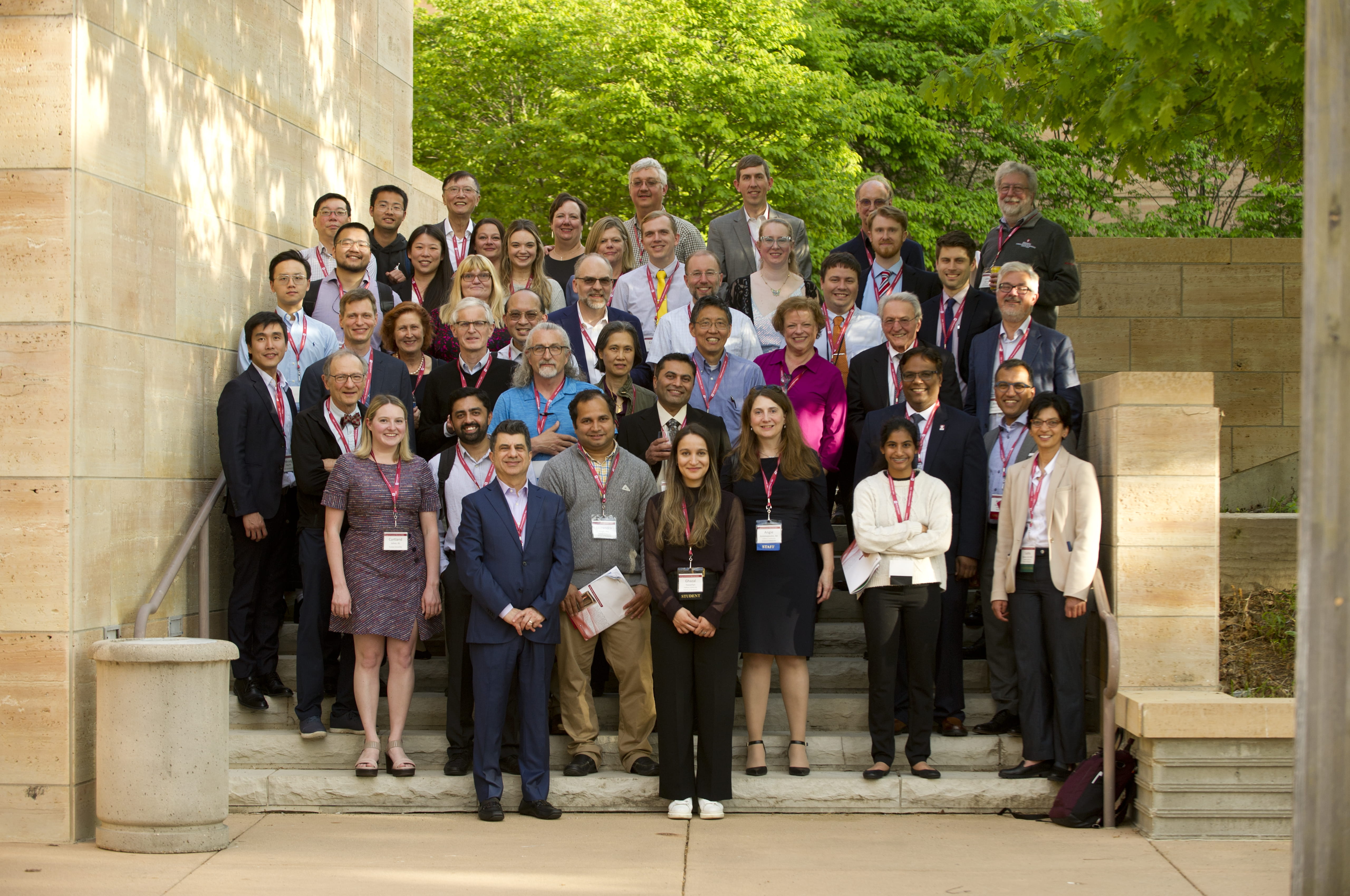 Krannert Biennial attendees stand on steps outside Eiteljorg Museum.