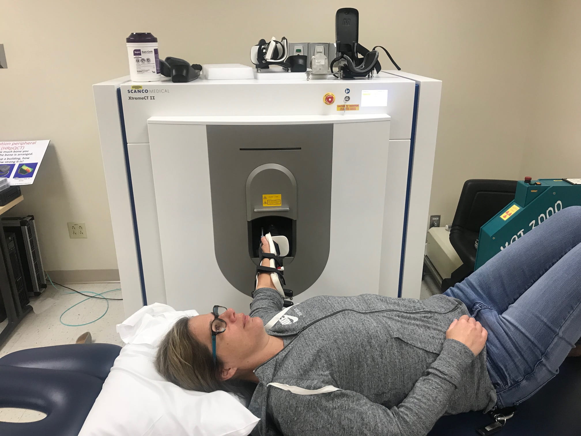 a woman receives a ct scan on her arm