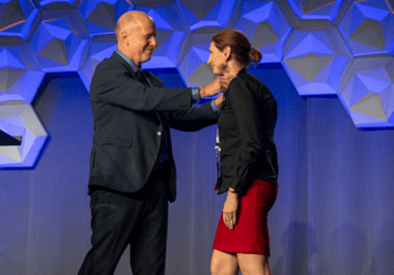 Andrea Conroy, PhD, receiving the 2023 Bailey K. Ashford Medal