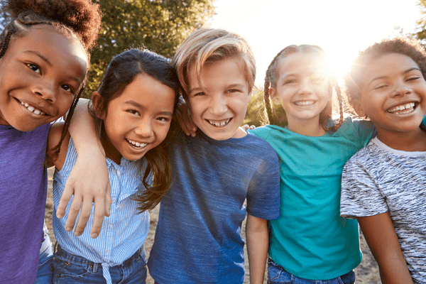 Group photo of 5 children outdoors