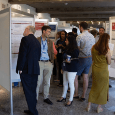 Candid photo of IU researchers at ICAN 2023 event