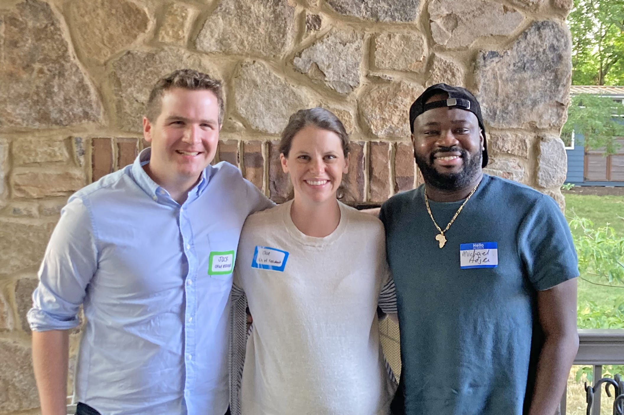 the three chief residents from anesthesia stand together in an outdoor picnic shelter