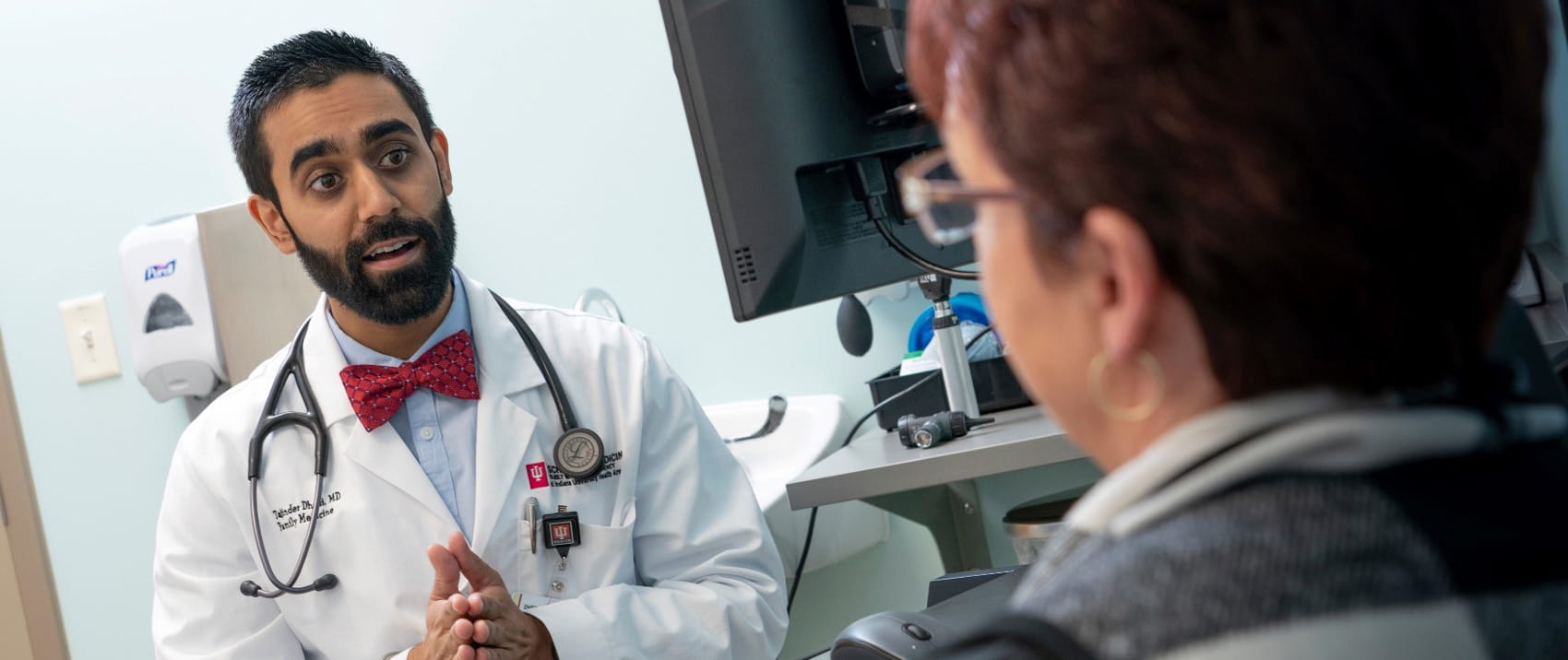 a resident in the arnett family medicine program speaks with a patient in the clinic