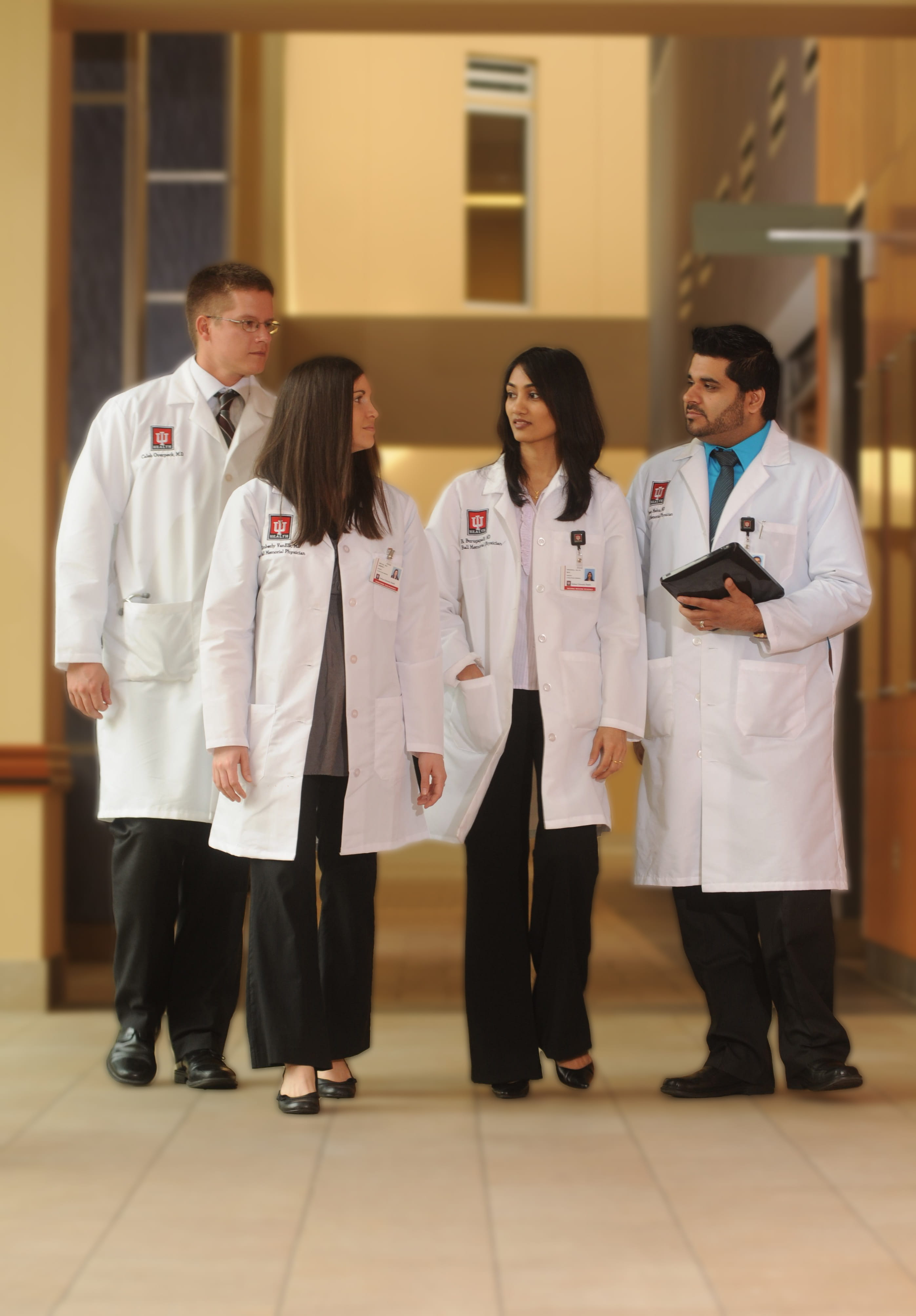 residents walk down the hall together