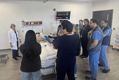 Residents being instructed on bedside practices.