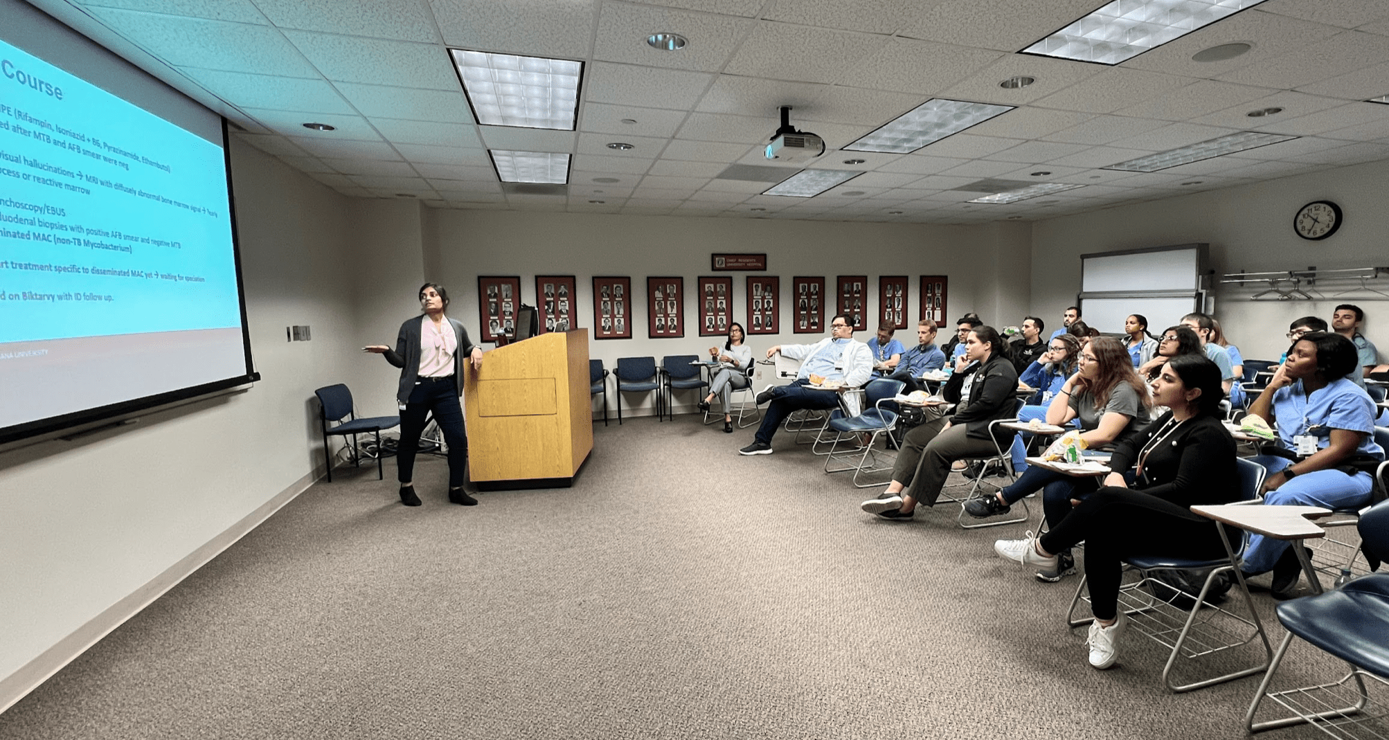 Residents during a noon lecture led by a peer.