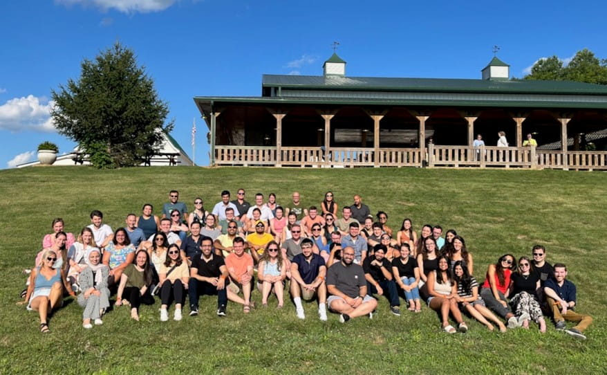 residents group photo outside in the grass