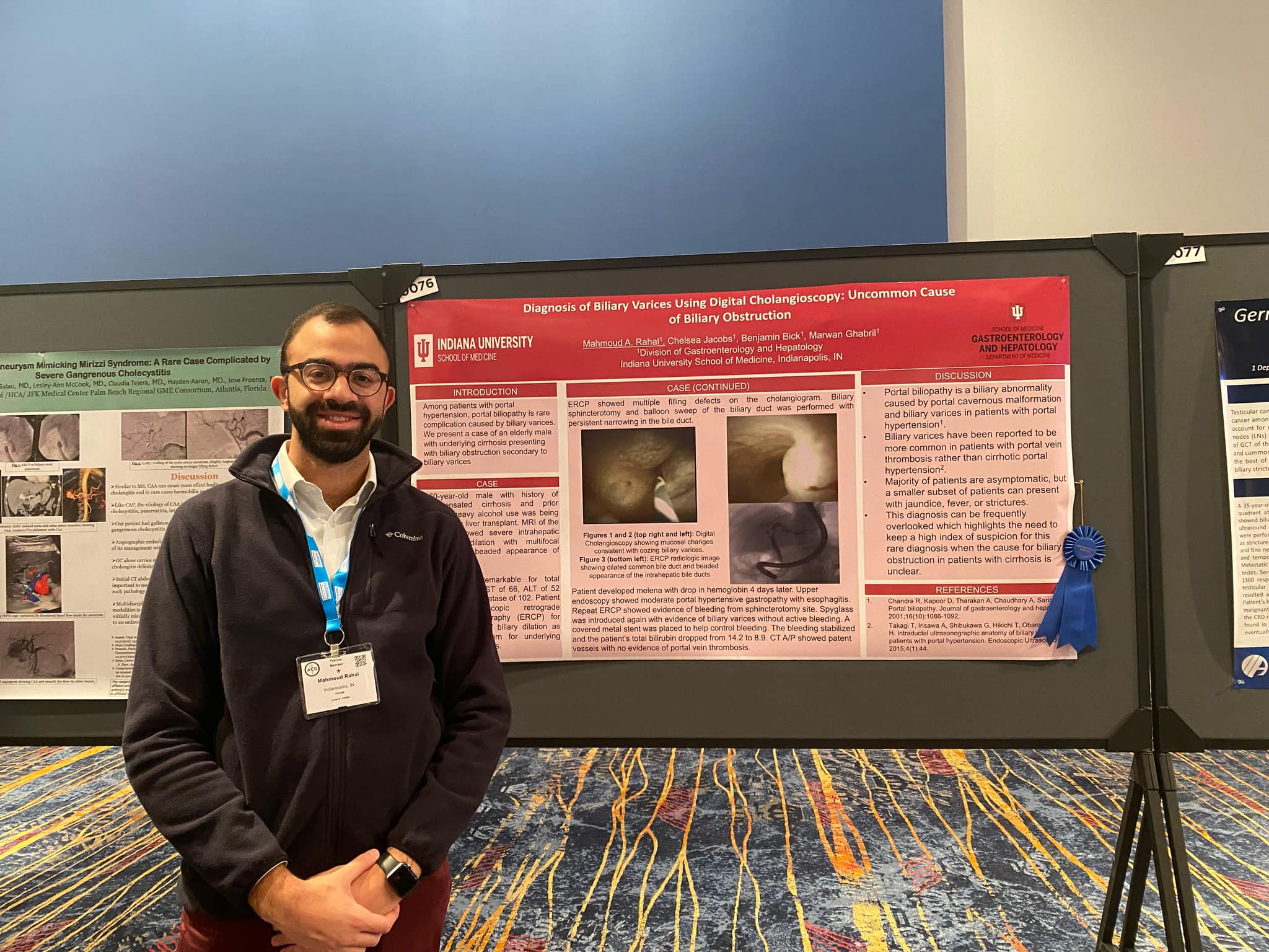 Moe Rahal Standing with His Poster at ACG 2022 Conference