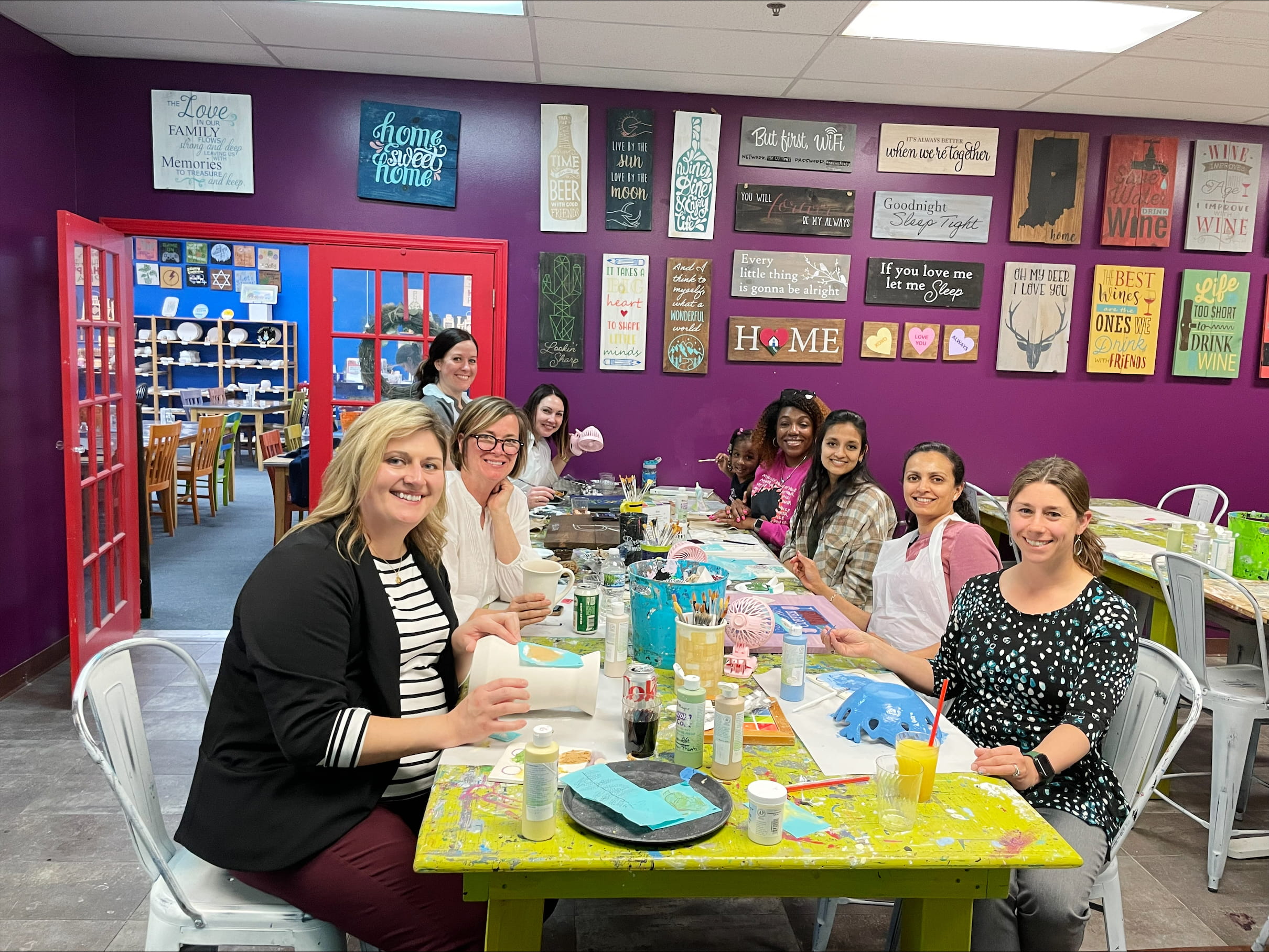 Photo of the Women in GI crafting in an art studio.