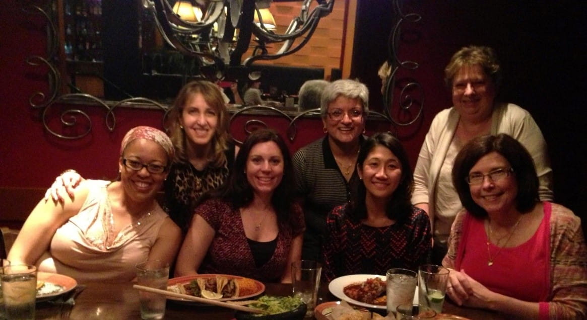 fellows sit together at a restaurant