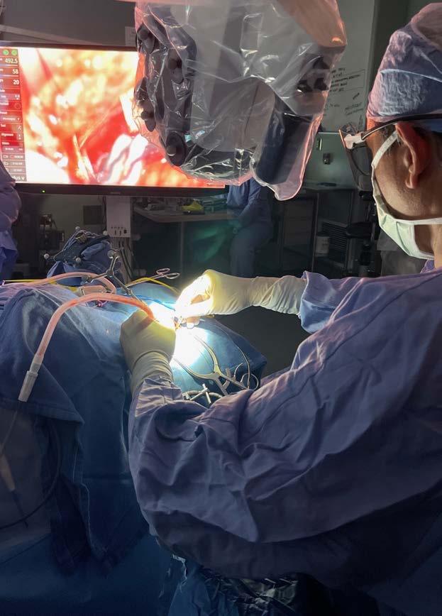 Surgeon performing skull base surgery in the operating room