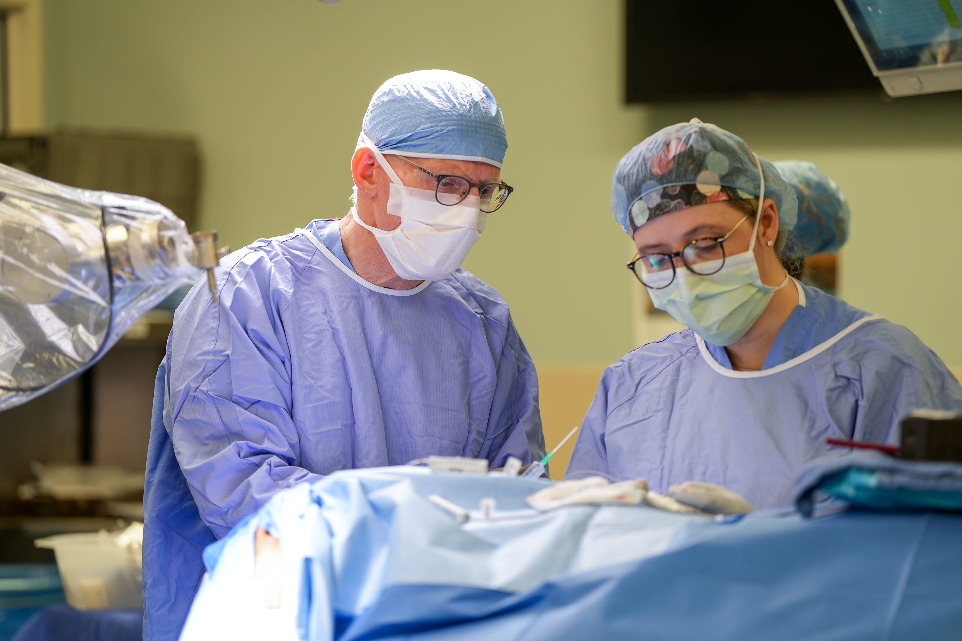 surgeon and resident in the OR