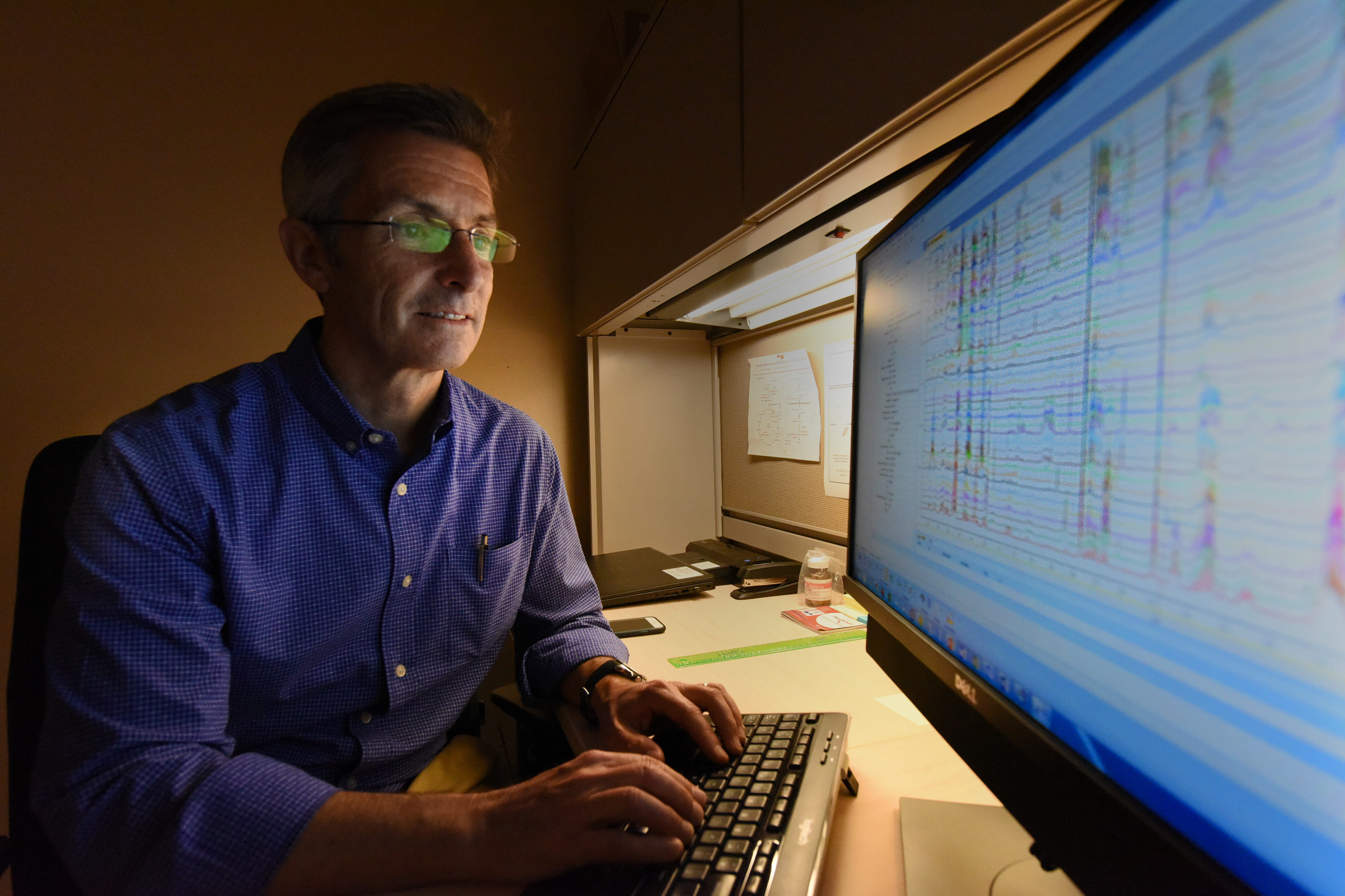 Dr. Thomas O'Connel working at computer