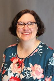 portrait of a woman in a floral shirt