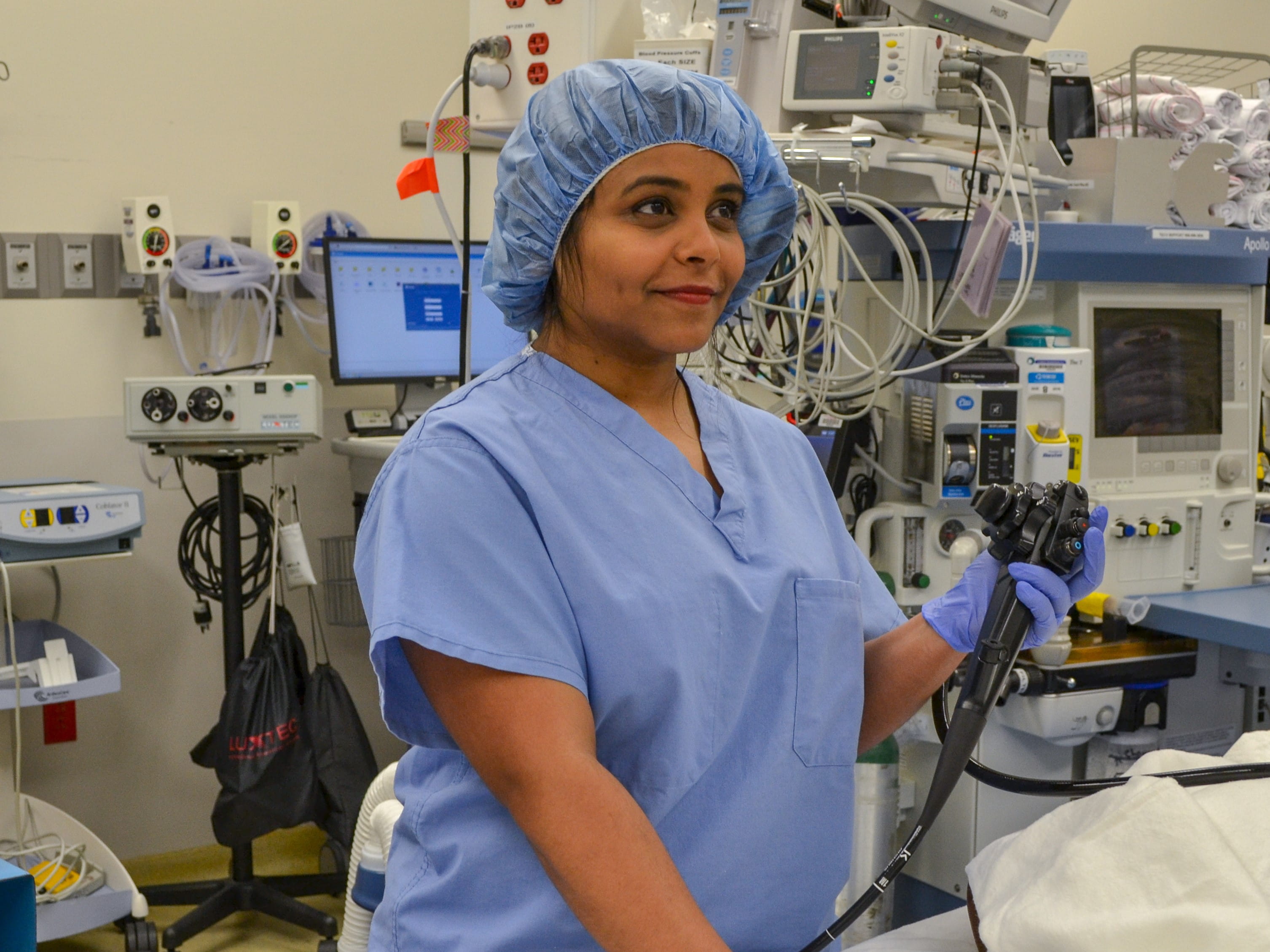 Fellow in the Division of Pediatric Gastroenterology performs a procedure.